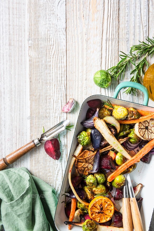 Mixed root vegetable roast with herbs. Healthy simple grill food Stock